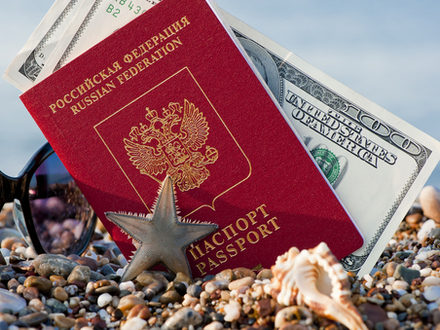 Still traveling with a Russian passport in the sand on the beach