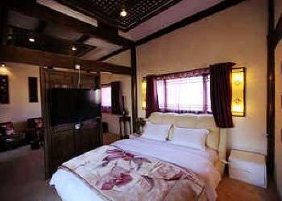 фото отеля Lijiang Yunjin Yaju Courtyard Hotel
