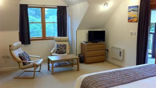 фото отеля Tanglewood Lodge Bed & Breakfast