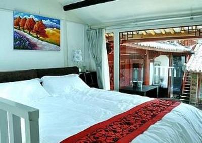 фото отеля Lijiang Free Cloud Guesthouse