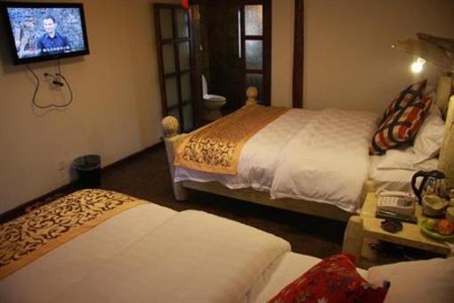 фото отеля Lijiang Sweet Garden Hotel