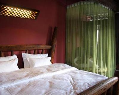 фото отеля Lijiang Sweet Garden Hotel