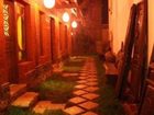 фото отеля Lijiang Sweet Garden Hotel