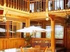фото отеля Lijiang Hefenghut Inn