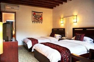 фото отеля Bashilai Inn Lijiang Bayi