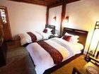 фото отеля Bashilai Inn Lijiang Bayi