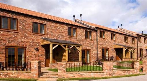 фото отеля Red House Farm Cottages