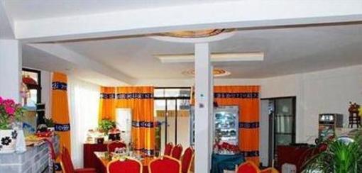 фото отеля Wu Family Courtyard Mongolian Style Inn Tengchong