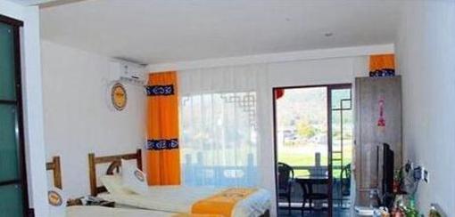 фото отеля Wu Family Courtyard Mongolian Style Inn Tengchong