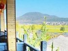 фото отеля Wu Family Courtyard Mongolian Style Inn Tengchong