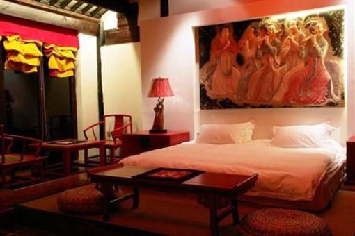 фото отеля Lijiang Zheng Fu Cao Tang Inn Shu Xiang Mansion