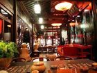 фото отеля Lijiang Zheng Fu Cao Tang Inn Shu Xiang Mansion