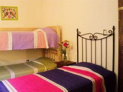 фото отеля Al Son de los Santos . Hostal Artesanal