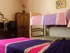 фото отеля Al Son de los Santos . Hostal Artesanal