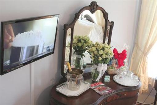 фото отеля Gardenia Inn