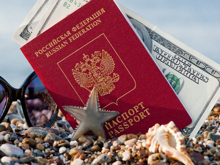 Still traveling with a Russian passport in the sand on the beach