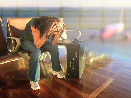 Depressed woman awaiting for plane