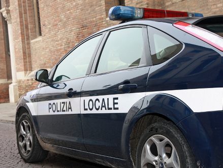 Municipal police car patrol in a town in Italy