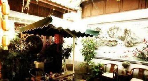 фото отеля Lijiang Happiness Inn