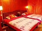 фото отеля Lijiang Happiness Inn