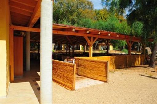 фото отеля Is Arenas Camping Village