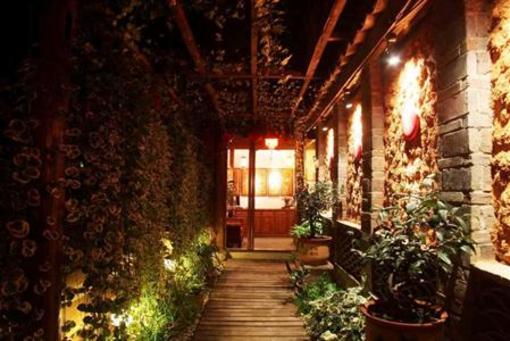 фото отеля Lijiang Homeland Inn Courtyard 1