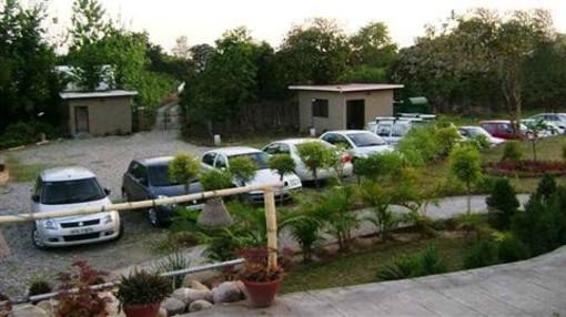 фото отеля Corbett Tiger Den Resort Ramnagar