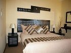 фото отеля Bar-t-Nique Guest House