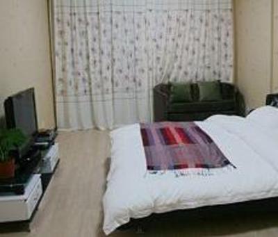 фото отеля Saga Inn Jinbi Apartment Kunming
