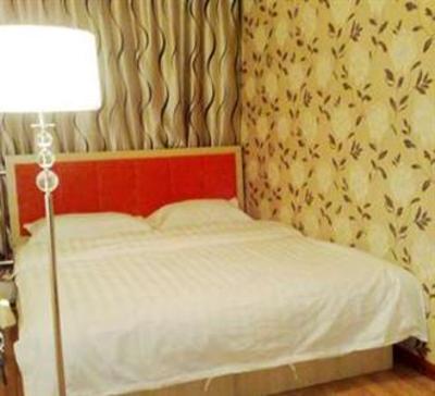 фото отеля Xingsu Family Inn Yantai Shiji Huafu
