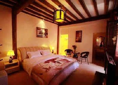 фото отеля Lijiang Yunjin Yaju Courtyard Hotel