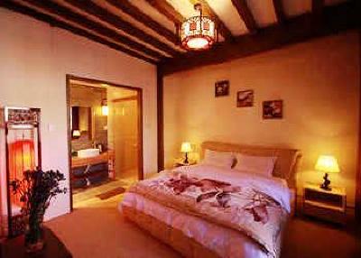 фото отеля Lijiang Yunjin Yaju Courtyard Hotel