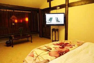 фото отеля Lijiang Yunjin Yaju Courtyard Hotel