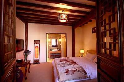 фото отеля Lijiang Yunjin Yaju Courtyard Hotel