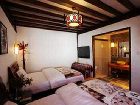 фото отеля Lijiang Yunjin Yaju Courtyard Hotel