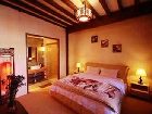 фото отеля Lijiang Yunjin Yaju Courtyard Hotel