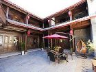 фото отеля Lijiang Yunjin Yaju Courtyard Hotel