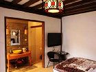 фото отеля Lijiang Yunjin Yaju Courtyard Hotel