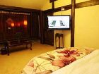 фото отеля Lijiang Yunjin Yaju Courtyard Hotel