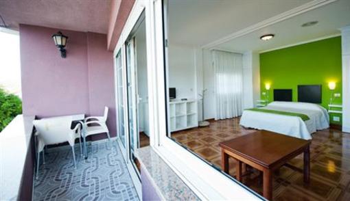 фото отеля Aparthotel Playa De Quenxe