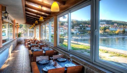 фото отеля Aparthotel Playa De Quenxe