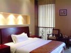 фото отеля Jiujiu Business Hotel Xinghu Street