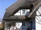 фото отеля Ferienhaus Rohrdachhus Middelhagen