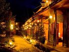 фото отеля Lijiang Shuimujiayuan Inn