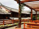 фото отеля Lijiang Shuimujiayuan Inn