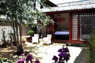 фото отеля Lijiang Free Cloud Guesthouse