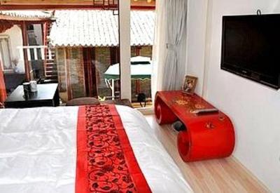 фото отеля Lijiang Free Cloud Guesthouse