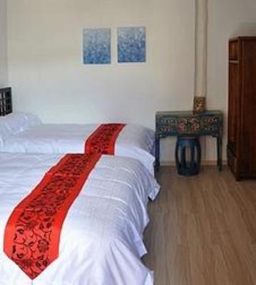 фото отеля Lijiang Free Cloud Guesthouse