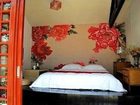 фото отеля Lijiang Free Cloud Guesthouse