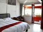 фото отеля Lijiang Free Cloud Guesthouse